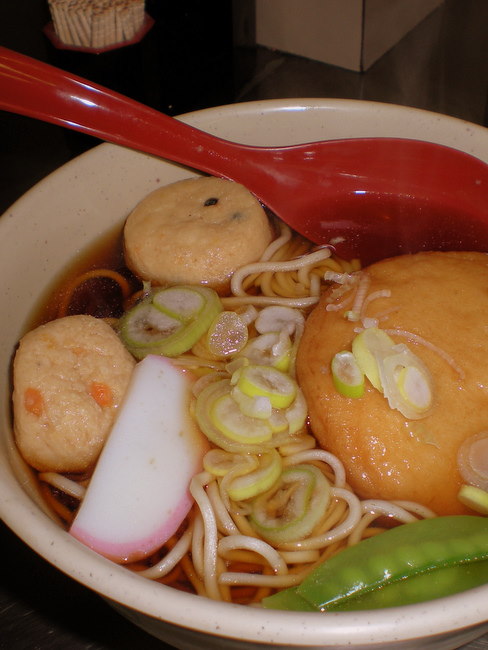 soba noodle soup with vegetables and fish cakes